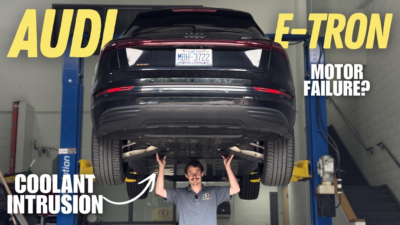 Out of Spec Renew inspects Audi e-tron motor coolant catch reservoir showing coolant intrusion