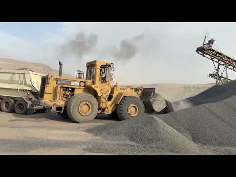 Caterpillar 980c wheel loader to load Sany truck trailer