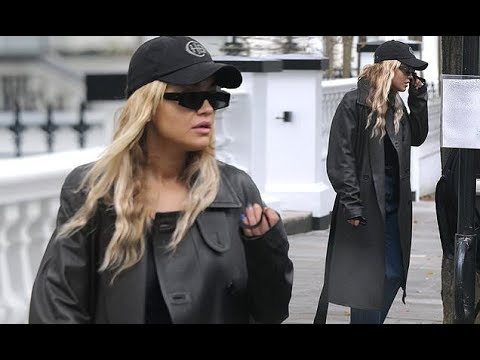 Rita Ora looks chic in leather coat and snakeskin boots