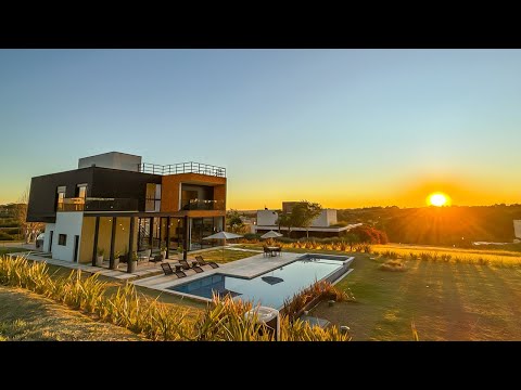 🏠 Casa M5 - Vista para área verde com pôr do sol e lago do rooftop.