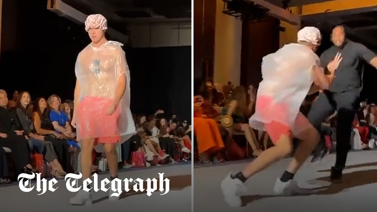 Watch Prankster in bin bag and shower cap invades catwalk at New York