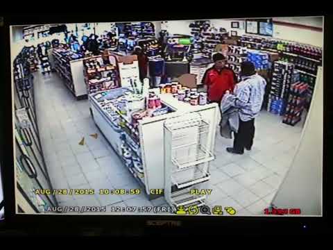 Caught thief stealing wine bottles