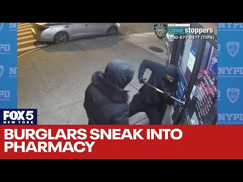 Watch burglars struggle to break into pharmacy