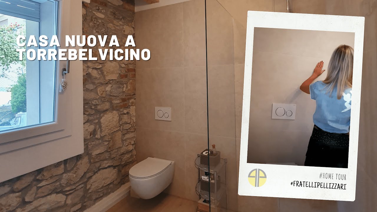 Bagno con pavimento in legno e rivestimento in piastrelle e pietra (#hometour pt.5)