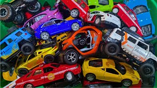 Box full of toy cars being shown after each other