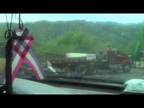Unloading pilings with a magnet crane at RJ Recycling