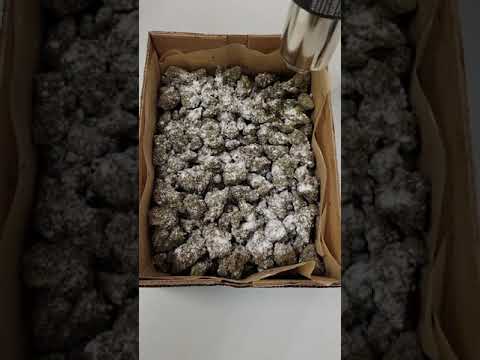 Hemp flower, covered in frozen delta 8 distillate that was crushed into powder.