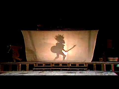 Παράβαση (50:12΄ και εξής) στην παράσταση των Αχαρνέων, από το [[#Θέατρο Τέχνης Καρόλου Κουν [Greek Art Theatre Karolos Koun]#]], σε σκηνοθεσία [[#Καρόλου Κουν [Karolos Koun]#]] και μετάφραση [[#Λεωνίδα Ζενάκου#]], θεατρική περίοδος 1976.