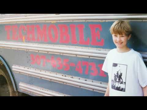 Boy in front of a bus. An Employer Flexible Pine Cove Commercial