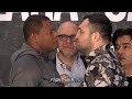 LUIS ORTIZ  GIVES CHRISTIAN HAMMER A COLD STARE DURING FACE OFF AT FINAL PRESS CONFERENCE