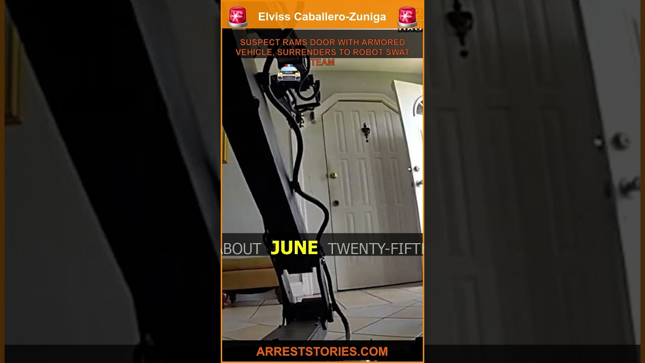 SUSPECT RAMS DOOR WITH ARMORED VEHICLE, SURRENDERS TO ROBOT SWAT TEAM