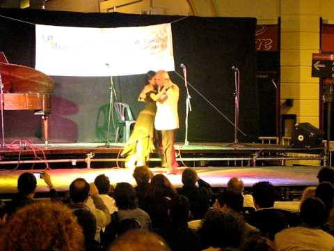  Julio Dupláa  and  Natacha Poberaj  are  dancing  to  the  tango  "  Nido Gaucho  "