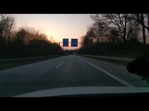 DRIVING IN GERMANY. Autobahn A24 in Schleswig-Holstein near Hamburg. Sunset.