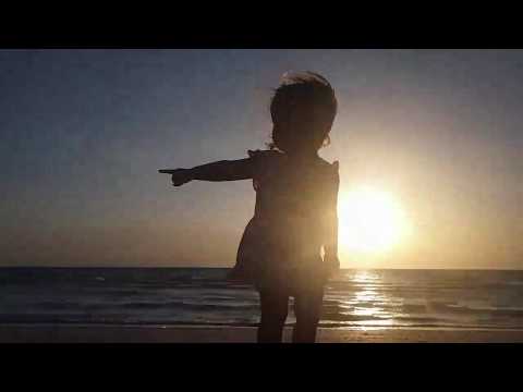 Adia walking on beach