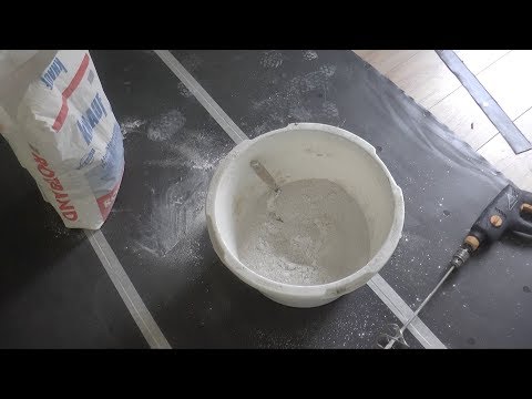 Een woning opknappen deel 3  Een muur van gipsplaat stucen