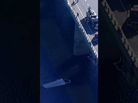 Box truck crashes off bridge into river