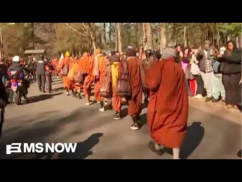 ‘Hope this brings unity, moments of reflection’: Thousands march with Buddhist monks on peace walk