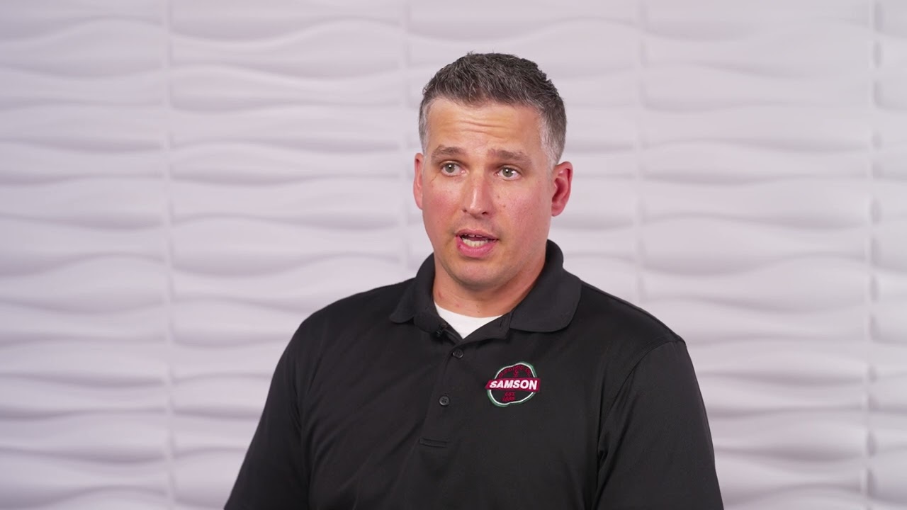 Click to: 0 auto;
    aspect-ratio: 16 / 9;
    background: #000;
    overflow: hidden;
    border-radius: 12px;
  }

  /* Fallback for browsers without aspect-ratio */
  @supports not (aspect-ratio: 16 / 9) {
    .video-wrapper {
      height: 0;
      padding-top: 56.25%; /* 16:9 */
    }
    .video-wrapper > * {
      position: absolute;
      inset: 0;
    }
  }

  .video-poster,
  .video-wrapper iframe {
    width: 100%;
    height: 100%;
    object-fit: cover;
    display: block;
  }

  /* Play button */
  .play-button {
    position: absolute;
    inset: 0;
    margin: auto;
    width: 72px;
    height: 72px;
    border: none;
    border-radius: 50%;
    background: rgba(0, 0, 0, 0.55);
    cursor: pointer;
    transition: transform 0.2s ease, background 0.2s ease;
  }

  .play-button::before {
    content: 