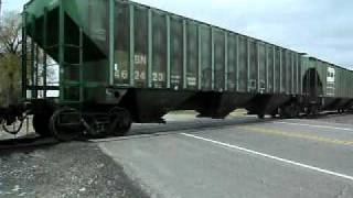 preview picture of video 'BNSF SD60s Lead a Manifest South Through Angus, MN'