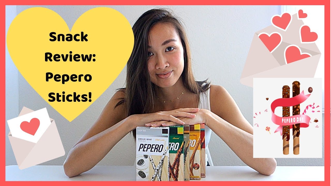 Five flavors of Pepero biscuit sticks displayed for a Pepero Day taste test review including white cookie choco filled and almond