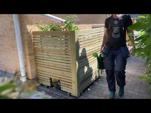 Klä in din regnvattentank i trä