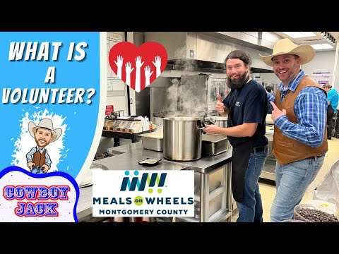 Two volunteers in a kitchen stand by a steaming large pot, promoting volunteers for Meals on Wheels Montgomery County (thumbnail text: 'What is a Volunteer?').**Let’s adjust to ensure clarity**