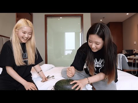Olivia Hye opening a watermelon with a spoon, twice