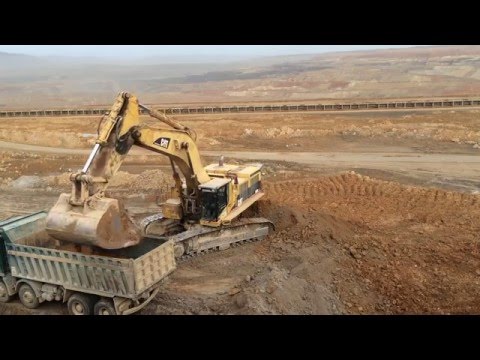 Caterpillar 385B LME Excavator Loading Mercedes Actros And MAN TGS Trucks