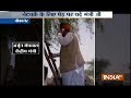 Modi Govt Minister Arjun Meghwal climbs on a tree to get network on his cell phone