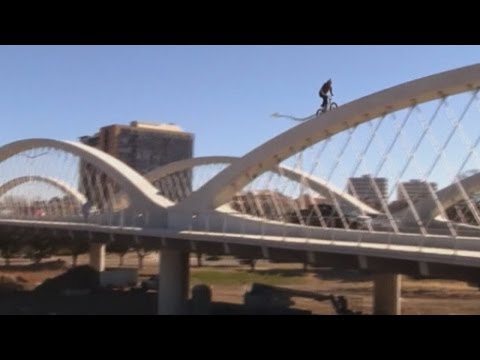 BMX stunt rider performs dangerous feat on Texas bridge