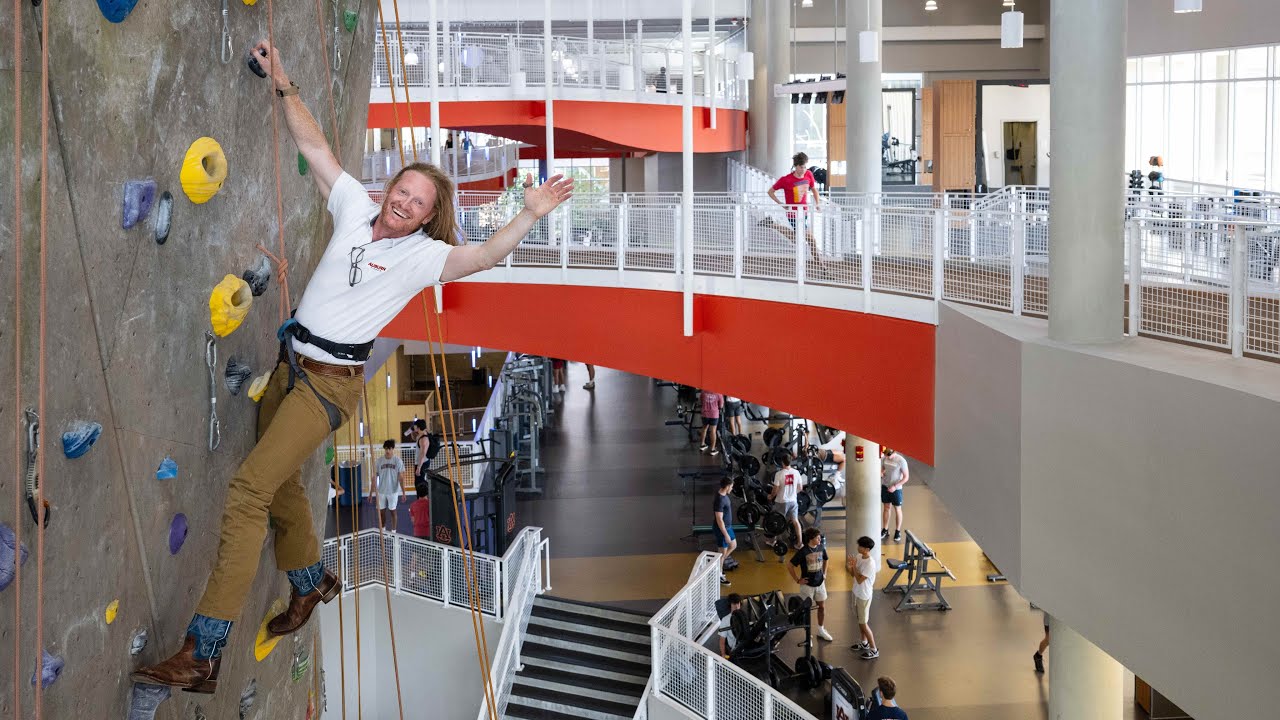 Eric Smith climbing a wall