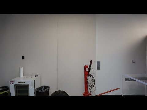 A Vintage Montgomery A-Series Hydraulic Elevator that is fully covered up.