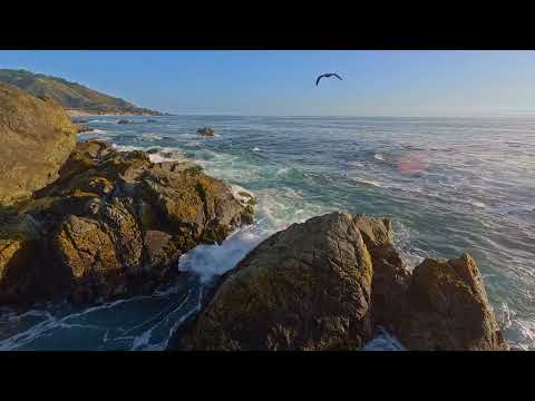 Cliffside view of Pacific Ocean Waves breaking on a Rocky Shoreline - Big Sur Coastline