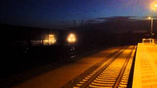 preview picture of video '[DB Schenker Rail] electric locomotive passing Ashausen station with a short freight train.'