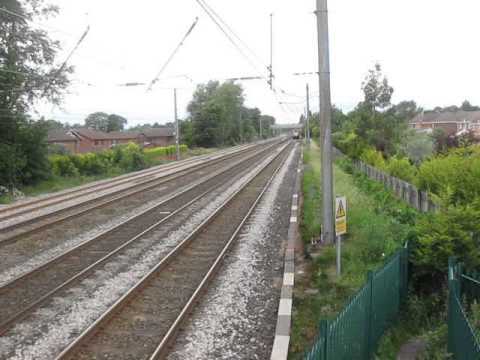 DRS 57012 and 57011 thrashing south at Euxton Balshaw Lane on 6K73 6th July 2010