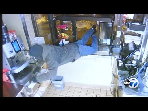 VIDEO: Burglars climb through Dunkin' Donuts drive-thru window