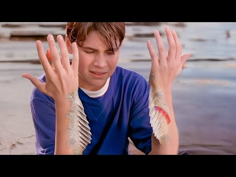 A boy gets bitten by a mermaid and starts turning into a fish