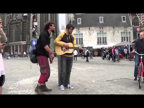 Street Music Guitar player Singer at Dam Square Amsterdam.