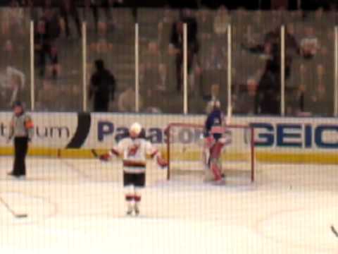 Footage of NJ Devils Ice Hockey with a crazy dancing fan!