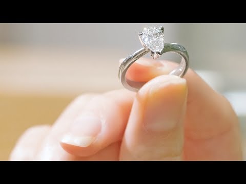 Internally Flawless Colourless Pear Shaped Diamond Twist Ring | The Village Goldsmith