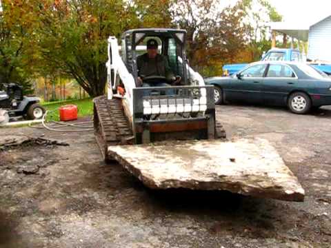 Bobcat T190 removing concrete floor from garage