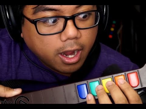 acai teaches new guitar hero players how to orange button