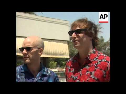 Musician Peter Buck of REM arrested in London airport for drunken assault.