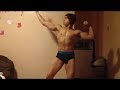 Teen bodybuilder flexing biceps