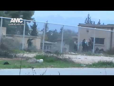 محاولات التقدم لمقاتلي كتيبة مجاهدي الشهباء في أحد أطراف مدرسة المشاة أثناء مجريات معركة المعركة