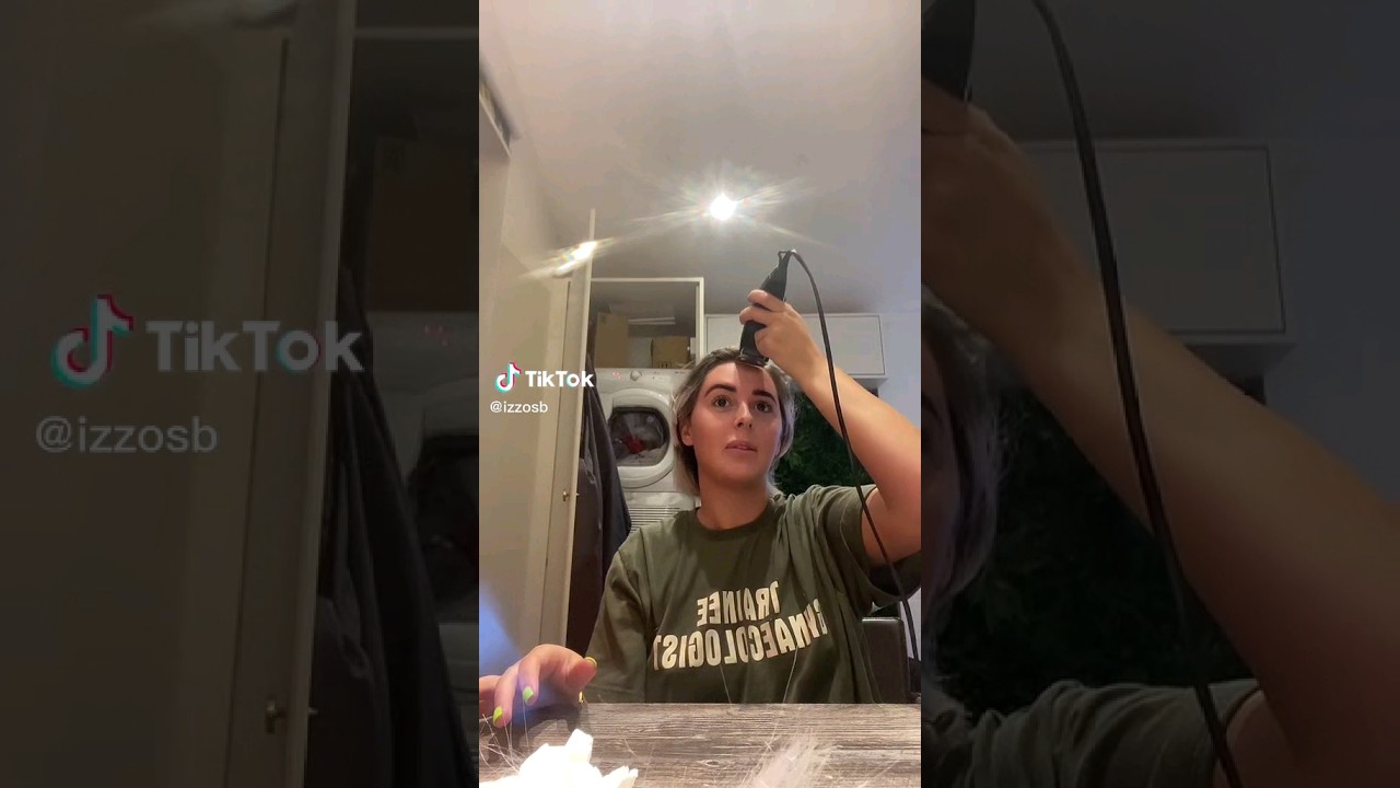 Woman Shaving Her Hair