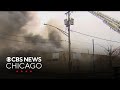 Fire crews monitor for hotspots after warehouse fire in Maywood