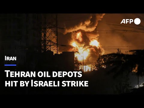 Flames blaze from Tehran oil depots hit by Israeli strike | AFP