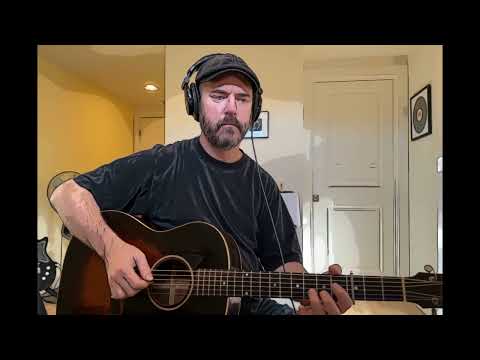 Josh playing bluegrass break on "Old Home Place" on acoustic guitar.