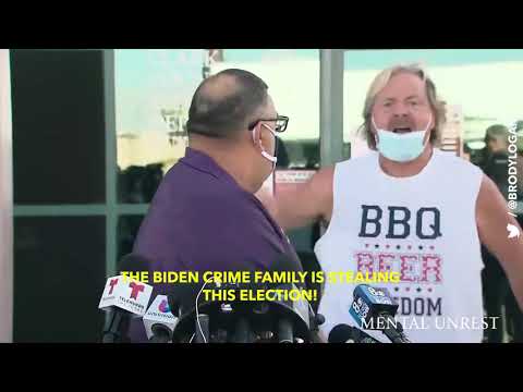 Trump follower with “BBQ BEER FREEDOM” shirt crashes press briefing to call out “Biden crime family”